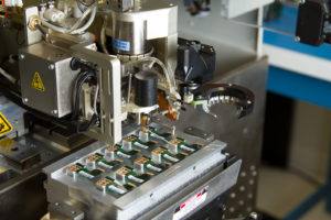 Inneos | Fiber Optic Components – Made in the USA A pick and place machine made by Palomar Technologies