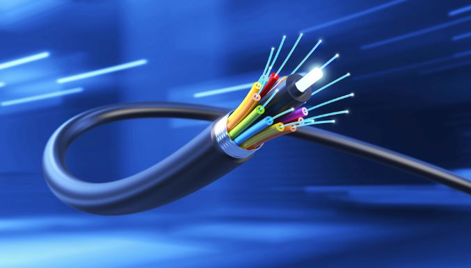 Inneos | The Need for Speed is Driving Fiber Adoption Rendering of a glowing fiber optic cable on a blue background.