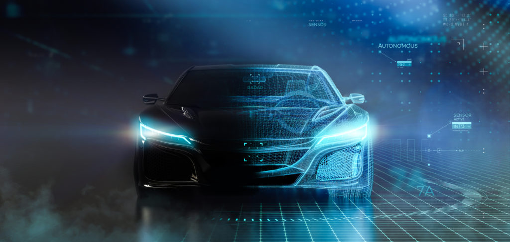 Inneos | Automotive Optical Ethernet Front view of a futuristic automotive with its headlights on.