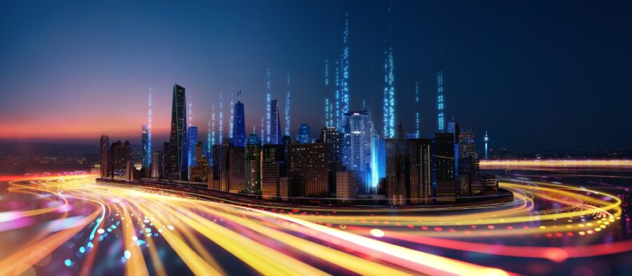 Streams of light surrounding a city, visualizing the use of optics vs. copper in automotive industries